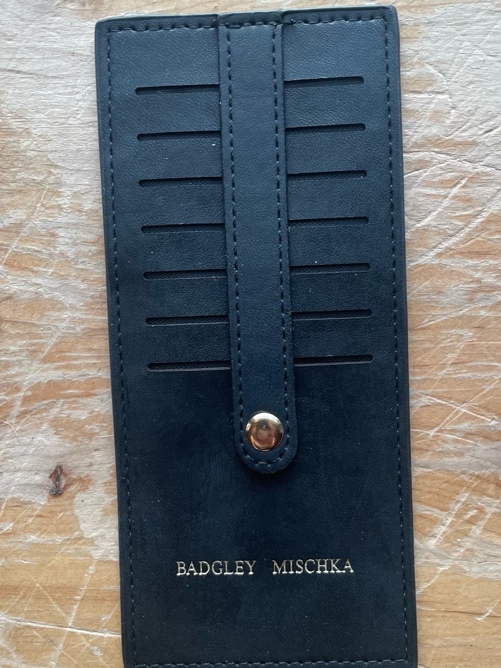 Badgley Mischka Black Leather Card Holder with Snap Strap and Gold Logo